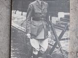 a black and white photo of a man in a military uniform