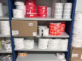 many rolls of paper on the shelves in the store