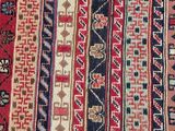 a close up of a red and blue oriental rug