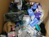 a cardboard box filled with assorted items in it