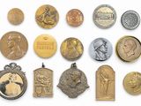 an image of a collection of medals and medals on a white surface