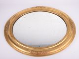 an image of a gold framed mirror on a white surface