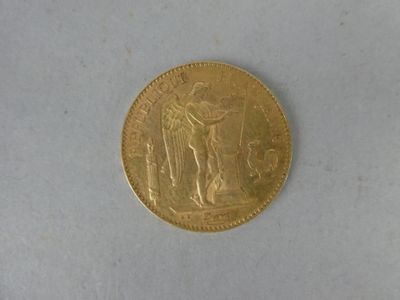 a gold coin with a picture of a woman on it