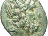 a close up of a coin with a face on it