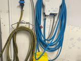 a metal basket with a blue hose attached to it
