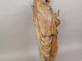 statue of a man holding a bird in his hand
