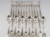 eight silver plated spoons and forks arranged on a white surface