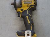 an image of a cordless drill on a concrete surface