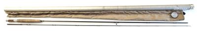two brushes and a roll of paper on a white surface