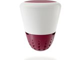 a red and white cup that is on a table