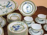 a lot of plates and cups on the table