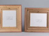 two wooden picture frames with a picture of a man and a woman