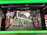 a tool box with tools in it on the floor