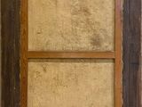an old picture of a window with a wooden frame on the outside