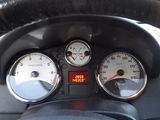 a close up of a car dashboard with three gauges