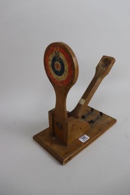 a wooden spoon and a wooden spoon rest on a stand