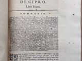 an open book with a black and white image of a clock on it