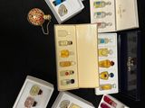 a lot of perfumes that are sitting on a table