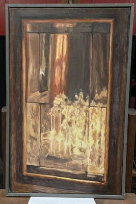 a picture of a painting on a table in front of a red wall