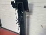 an image of a television on a stand in front of a garage