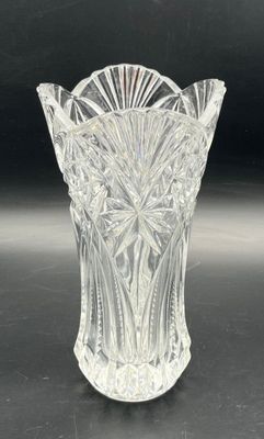 an image of a clear glass vase on a black surface