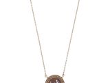 a necklace with a picture of a man and woman on it
