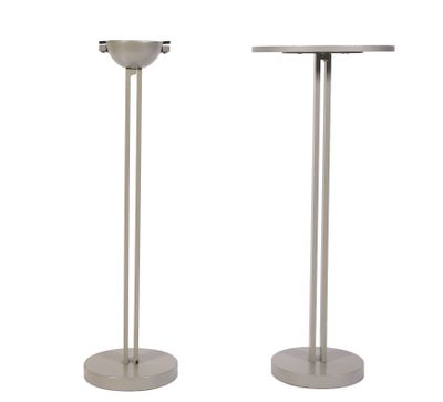 pair of stainless steel pedestals with a round top