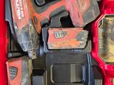 a red box with tools in it sitting on the floor