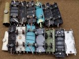 a lot of old train parts sitting on the ground
