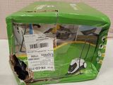 a green box with a black and white cat inside of it
