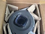 a cardboard box with a plastic object inside of it