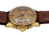 a gold watch with a brown leather band on a white background