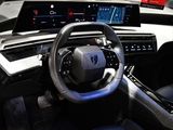 a steering wheel and dashboard of a car on display