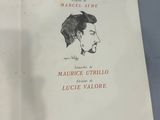 an open book with a drawing of a man ' s face on it