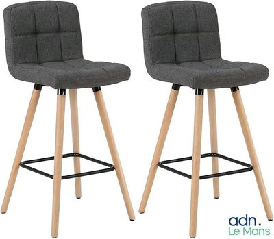pair of grey fabric bar stools with wooden legs