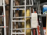many ladders that are leaning against the wall