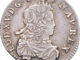 a close up of a silver coin with a woman on it
