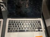 two laptops that are sitting on a table