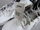 a tag on a pair of adidas shoes on a table