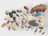 a lot of small figurines of animals on a white surface