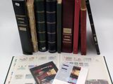 several books are stacked on top of each other on a table