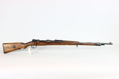 a rifle with a wooden barrel on a white background