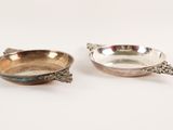 pair of silver plated bowls with handles and handles