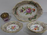 three plates and a bowl sitting on a table