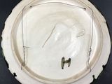 a white plate with a hole in the middle of it