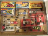 a lot of toy cars in a box on the table