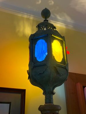 a clock that is on a pole in a room