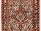 tapis persan antique à motif de médaillon sur fond rouge