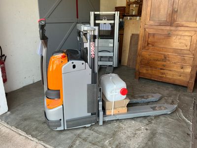 an image of a forklift truck in a garage