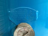 a close up of a pressure gauge on a blue tank